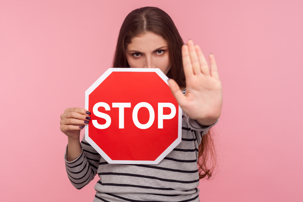 Woman Holding Stop Sign